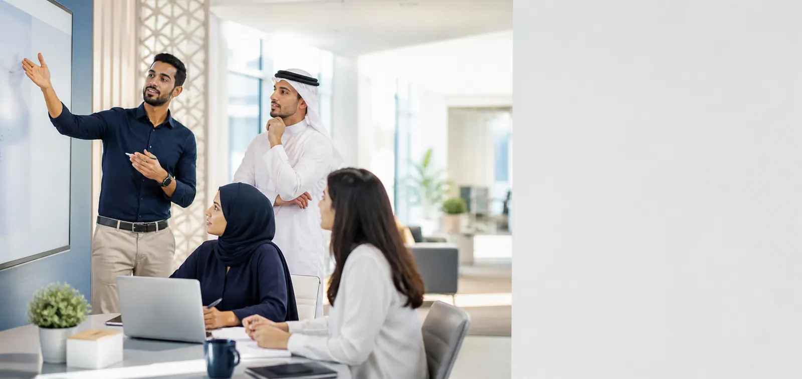 Team leader briefing colleagues on required skills in an office in Qatar